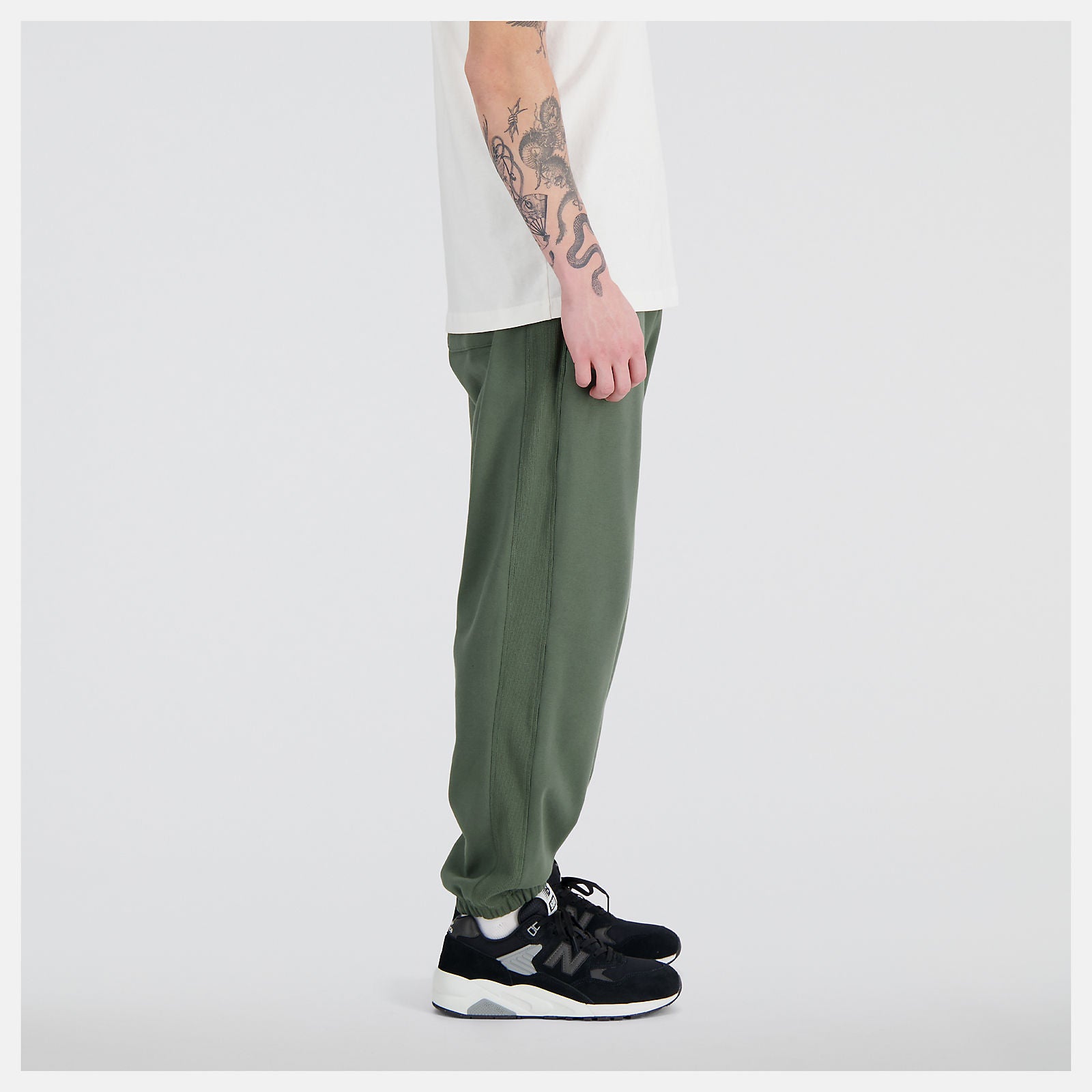 NEW BALANCE Pantalone Tuta Uomo Athletics Remastered MP31503 Deep Olive Green